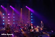 A wide shot of the stage at a live recording of a show.